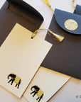 Unwritten 2- handcrafted stationery set, natural black paper A7 envelopes with bookmark style notes, elephant design, gold tassels- Set of 6