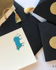 Unwritten 4 - handcrafted stationery set, black A7 gold liner envelopes, bookmark style notes, blue Nandi cow print, gold tassels - Set of 6