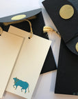 Unwritten 4 - handcrafted stationery set, black A7 gold liner envelopes, bookmark style notes, blue Nandi cow print, gold tassels - Set of 6