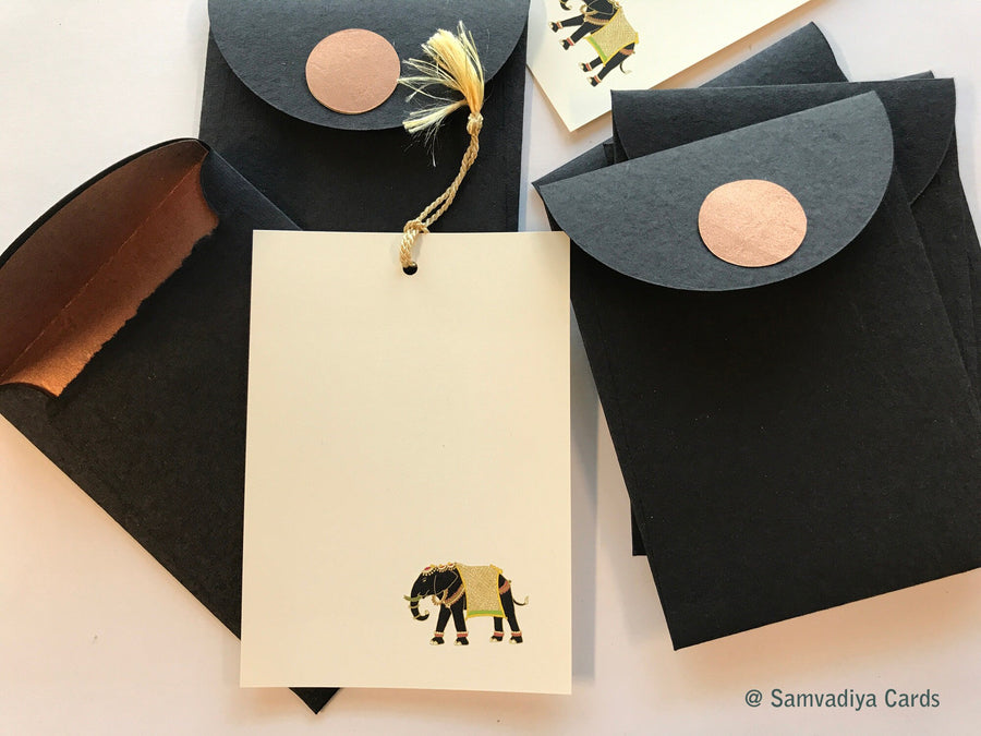 Unwritten 5- handcrafted stationery set, black A7 copper liner envelopes, bookmark style notes, black elephant print, gold tassels- Set of 6